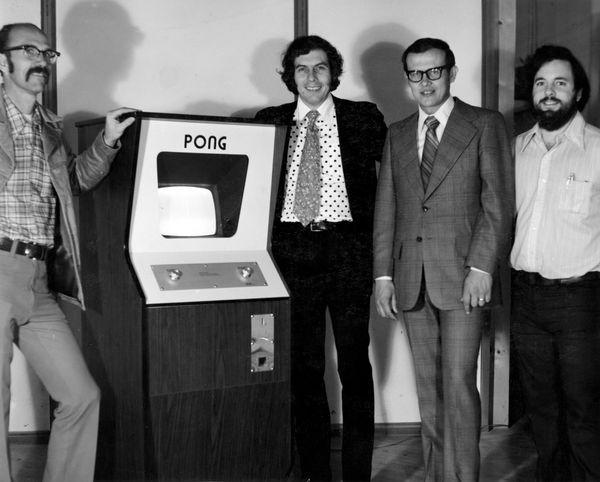Ted Dabney (left) in front of a Pong arcade machine in 1973 with Nolan Bushnell (founder of Atari), Fred Marincic, and Allan Alcorn. Courtesy Computer History Museum. Photo by Allan Alcorn